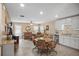 Open-concept floor plan featuring living room, dining area, and kitchen with lots of natural light at 6644 Longboat Dr, Brooksville, FL 34604