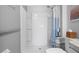 Accessible walk-in shower featuring grab bars and a built-in seat for added safety at 6644 Longboat Dr, Brooksville, FL 34604