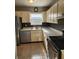 Classic kitchen with white cabinetry, and stainless steel appliances at 7028 Merrick Ln, Spring Hill, FL 34606