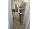Well organized laundry area with wire shelving at 7028 Merrick Ln, Spring Hill, FL 34606