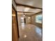 Bright living room boasting tile floors, exposed wood beam ceilings, and lots of natural light at 7028 Merrick Ln, Spring Hill, FL 34606