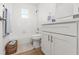 Bright full bathroom with white tiling, new vanity, and updated fixtures at 7048 Oberon Ave, Spring Hill, FL 34608