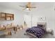 Comfortable bedroom with desk, chair, bed, and creative storage shelves at 7048 Oberon Ave, Spring Hill, FL 34608