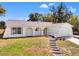 Charming single story home with arched entry, well manicured lawn and beautiful landscaping at 7048 Oberon Ave, Spring Hill, FL 34608