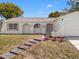 Inviting single story home features unique architecture, new landscaping, and attached garage at 7048 Oberon Ave, Spring Hill, FL 34608