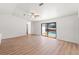 Open living room with sliding glass doors leading to a private backyard pool at 7048 Oberon Ave, Spring Hill, FL 34608