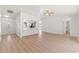 Open concept living and kitchen area features modern design and updated flooring and finishes at 7048 Oberon Ave, Spring Hill, FL 34608