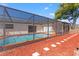 Relaxing screened pool area with surrounding mulch and stepping stones enhances outdoor living at 7048 Oberon Ave, Spring Hill, FL 34608