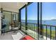 Balcony overlooking the lake, with seating and serene views for relaxation and enjoyment at 8211 Brent St # 816, Port Richey, FL 34668