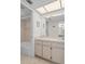 Bathroom boasts a tub shower combo, a large mirror, and ample vanity storage at 8211 Brent St # 816, Port Richey, FL 34668