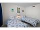 Comfortable bedroom with twin beds with seashell-themed bedding, soft lighting, and decorative wall art at 8211 Brent St # 816, Port Richey, FL 34668