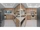 Functional kitchen featuring wooden cabinets and modern appliances, creating an inviting culinary space at 8211 Brent St # 816, Port Richey, FL 34668