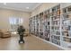 Well-stocked library with floor-to-ceiling bookshelves, and a cozy seating area, perfect for reading at 8211 Brent St # 816, Port Richey, FL 34668