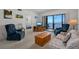 Bright and spacious living room with water views from the screened balcony and cozy seating at 8211 Brent St # 816, Port Richey, FL 34668
