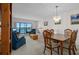 Bright living room with a view, comfortable seating, and an elegant dining area perfect for relaxation and gatherings at 8211 Brent St # 816, Port Richey, FL 34668
