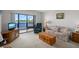 Cozy living room with a large window overlooking the water and comfortable seating arrangements at 8211 Brent St # 816, Port Richey, FL 34668
