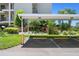 Designated covered parking area with landscaping and unit number clearly marked at 8211 Brent St # 816, Port Richey, FL 34668