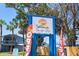 Bright and colorful sign for Seanyle Cove featuring waterfront graphics at 8211 Brent St # 816, Port Richey, FL 34668