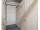 Interior view of storage units, with multiple numbered wooden doors and concrete flooring at 8211 Brent St # 816, Port Richey, FL 34668