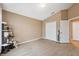 Spacious carpeted bedroom featuring a closet, neutral walls, and a vaulted ceiling at 8407 Blue Rock Dr, New Port Richey, FL 34653