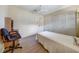 Cozy bedroom featuring wood-look flooring, a ceiling fan, and closet space at 8420 Winding Wood Dr, Port Richey, FL 34668