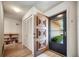 Inviting entryway featuring a decorative front door, closet, and wood-look flooring at 8420 Winding Wood Dr, Port Richey, FL 34668