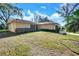 Charming single-story home with a well-maintained lawn and driveway at 8420 Winding Wood Dr, Port Richey, FL 34668