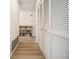 Hallway with closet and bookshelf at 8420 Winding Wood Dr, Port Richey, FL 34668