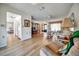 Open-concept living space with stylish furnishings, leading to the kitchen and entryway at 8420 Winding Wood Dr, Port Richey, FL 34668