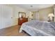 Main bedroom with wood dresser, and closet space at 8420 Winding Wood Dr, Port Richey, FL 34668