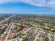 Aerial view of the home in a suburban community near local roads, water, and greenery at 8528 Viva Via Dr, Hudson, FL 34667