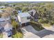 Aerial view of a coastal home near a canal, showcasing nearby waterfront properties at 8721 Old Post Rd, Port Richey, FL 34668