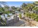 This backyard features a patio, firepit, water access and plenty of space for outdoor entertaining at 8721 Old Post Rd, Port Richey, FL 34668