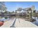 Dock featuring a Sea Mount boat lift for easy water access and boat storage at 8721 Old Post Rd, Port Richey, FL 34668