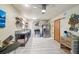 Bright kitchen featuring stainless steel appliances, open shelving, and light-colored flooring at 8721 Old Post Rd, Port Richey, FL 34668