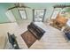 Inviting living room with a dark sofa, a fireplace, and access to an outdoor space at 8721 Old Post Rd, Port Richey, FL 34668