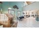 Open living space with kitchen view, natural light, light floors, and a wooden ceiling at 8721 Old Post Rd, Port Richey, FL 34668