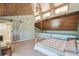 Unique main bedroom featuring a wood ceiling, plush carpet, and access to an ensuite bathroom at 8721 Old Post Rd, Port Richey, FL 34668