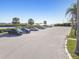 A waterfront parking area with spaces available, scenic views and palm trees at 8721 Old Post Rd, Port Richey, FL 34668