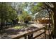 Lush backyard featuring mature trees, partial fencing, and a horse, creating a serene and inviting outdoor space at 9382 Wild Horse Trl, Brooksville, FL 34601