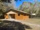 Exterior of well-maintained barn, featuring green trim accents at 9382 Wild Horse Trl, Brooksville, FL 34601