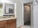Elegant bathroom with granite countertop, vanity, and glass-enclosed tiled shower at 9382 Wild Horse Trl, Brooksville, FL 34601