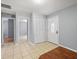 Bright foyer with tile flooring, closet space, and an entry door with decorative glass at 9382 Wild Horse Trl, Brooksville, FL 34601