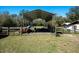 Outdoor storage shed or outbuilding with green grass in a rural setting at 9382 Wild Horse Trl, Brooksville, FL 34601