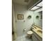 Bright bathroom features a vanity with sink, toilet, and framed art in a well-lit space at 11121 Linkside Dr # 11121, Port Richey, FL 34668