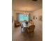 Traditional dining room with tile flooring, chandelier, and a garden view from the window at 11121 Linkside Dr # 11121, Port Richey, FL 34668
