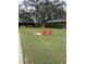 Outdoor horseshoe pit area surrounded by lush greenery and seating for relaxing games at 11121 Linkside Dr # 11121, Port Richey, FL 34668