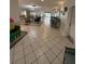 Inviting lobby with tile flooring, comfortable seating, and a welcoming atmosphere for residents at 11121 Linkside Dr # 11121, Port Richey, FL 34668