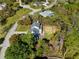 Birds-eye view of the home and surrounding property in a wooded neighborhood at 11227 Lakeview Dr, New Port Richey, FL 34654