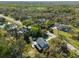 Aerial view of the home and surrounding neighborhood with mature trees and landscaping at 11227 Lakeview Dr, New Port Richey, FL 34654